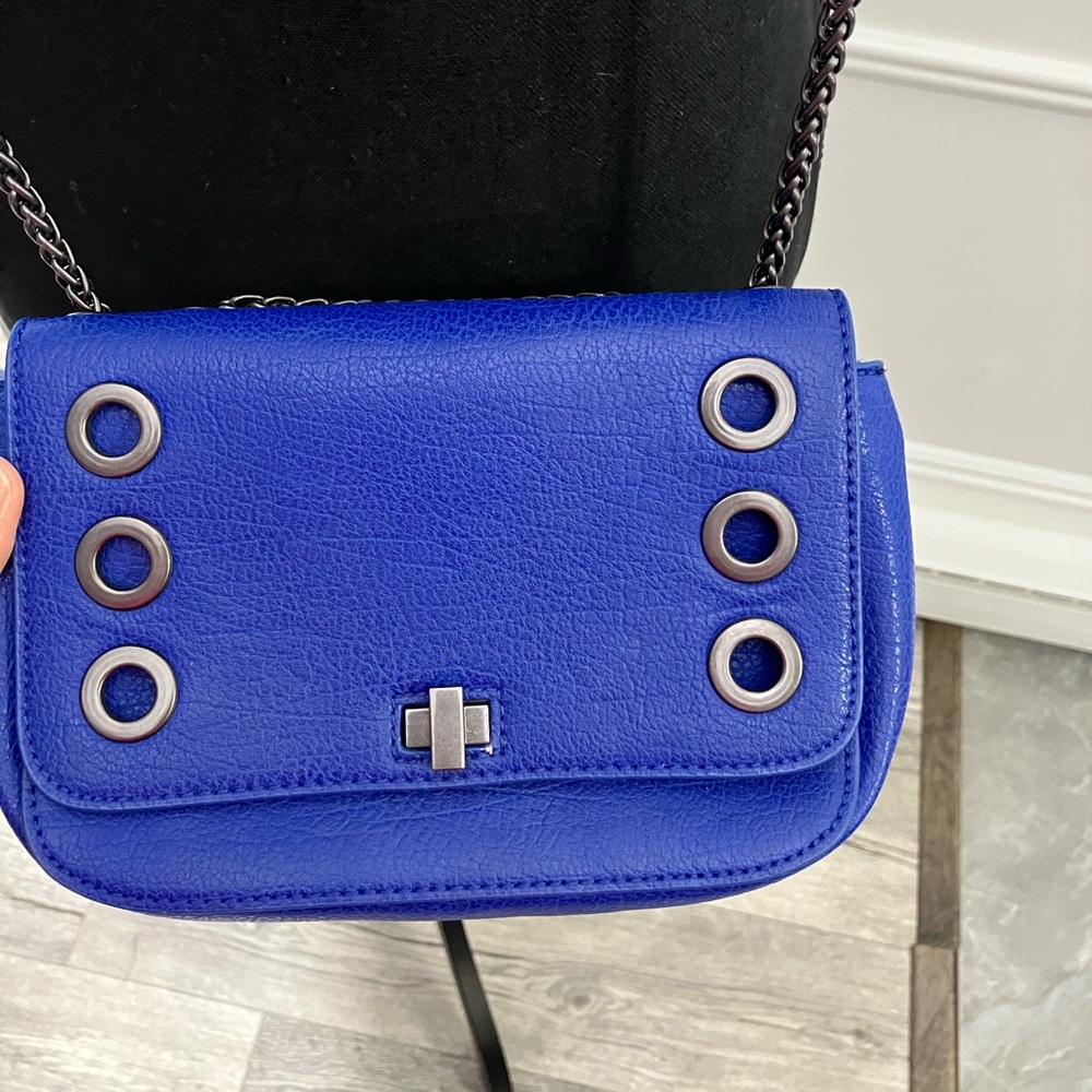 Inc brand blue hand bag with silver chain  grommets. Pre-owned good condition.